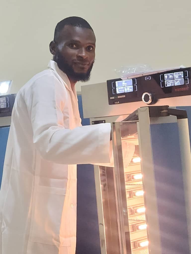 Researcher operating incubation system in the Climate Simulation Laboratory